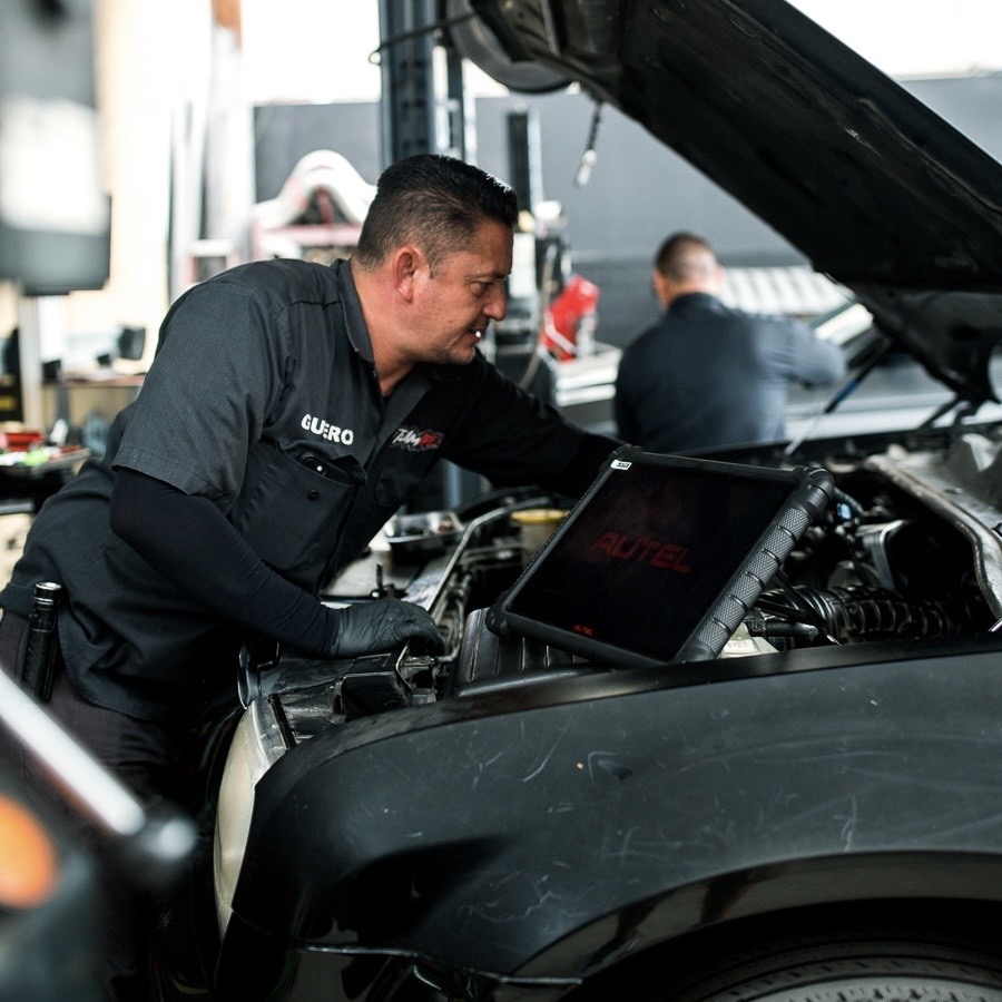 Güero running an Autel diagnostic scan on a customer vehicle