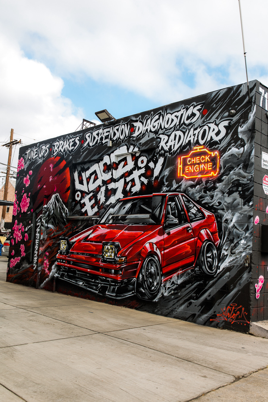 Vaca Motorsports exterior mural with AE86 artwork