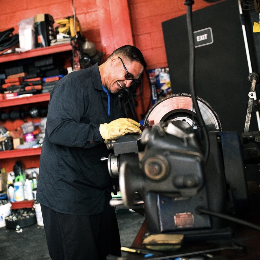 Vaca Motorsports technician working a brake lathe